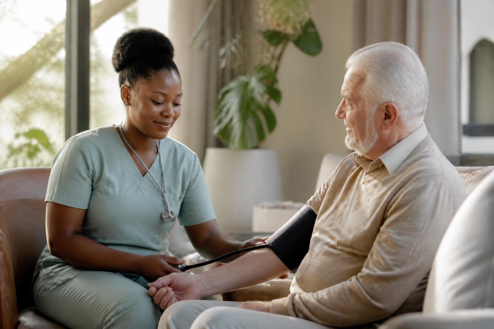 Registered nurse caring for an elderly patient in his living room
